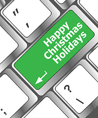 Image showing happy christmas holidays button on computer keyboard key