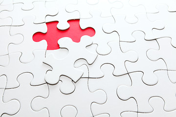 Image showing Missing jigsaw piece in red color