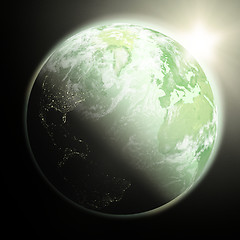 Image showing Sun rising over Earth