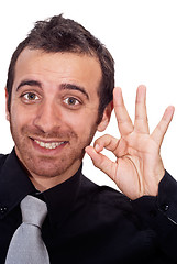 Image showing Young businessman makes OK sign