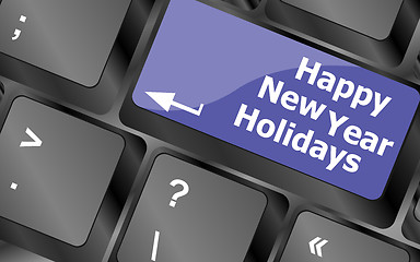 Image showing happy new year holidays button on computer keyboard key