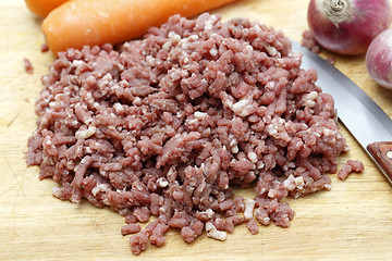 Image showing Raw mince with onions and carrots