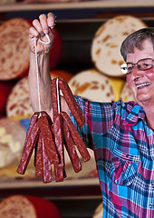 Image showing butcher shop in Germany with female seller