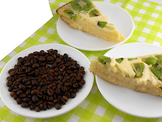 Image showing kiwi cake on white plate with coffee beans