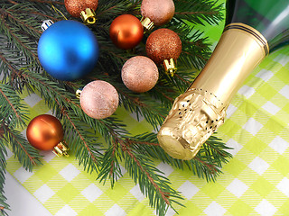 Image showing champagne bottle and christmas baubles, Merry Christmas and Happy New Year