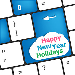 Image showing happy new year holidays button on computer keyboard key