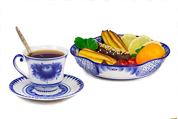 Image showing Cup of tea, cakes, sweets, fruit bowl, painted in the style of t