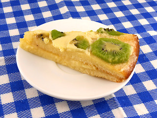 Image showing kiwi tasty cake close up at plate