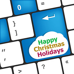 Image showing happy christmas holidays button on computer keyboard key