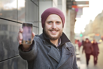 Image showing Young man with smartphone