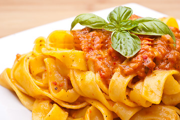 Image showing Pasta decorated with basil leaves