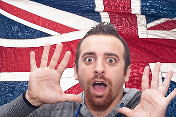 Image showing young amazed man portrait with british flag