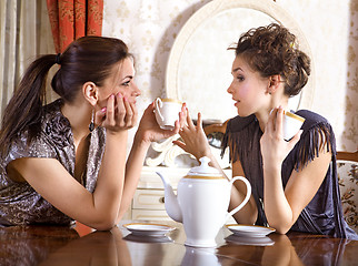 Image showing Two pretty girl-friends drink tea