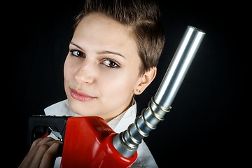 Image showing Woman with fuel nozzle closeup