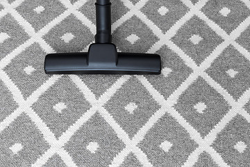 Image showing Vacuum cleaner on gray carpet