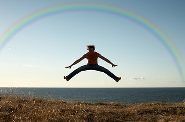 Image showing learning to fly under rainbow