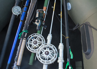 Image showing Prepared for fishing, spinning, fishing rods, rubber boat.