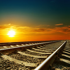 Image showing orange sunset over railroad