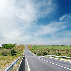 Image showing cloudy sky over asphalt road