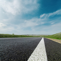 Image showing white line on asphalt road and cloudy sky
