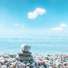 Image showing zen-like stones on beach. soft focus