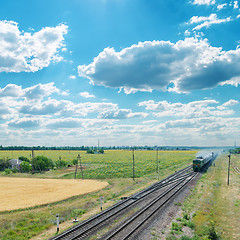 Image showing old train on railroad under cloudy sky