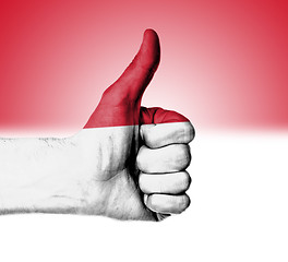 Image showing Closeup of male hand showing thumbs up sign