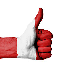 Image showing Closeup of male hand showing thumbs up sign