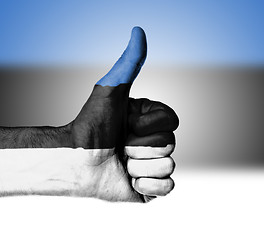 Image showing Closeup of male hand showing thumbs up sign