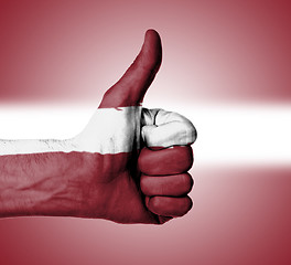 Image showing Closeup of male hand showing thumbs up sign