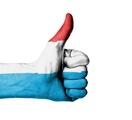 Image showing Closeup of male hand showing thumbs up sign