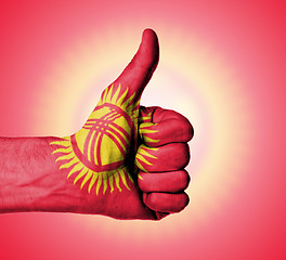 Image showing Closeup of male hand showing thumbs up sign