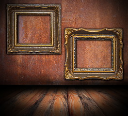 Image showing empty painting frames on rusted wall