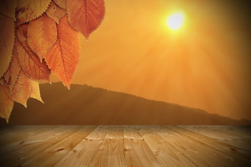 Image showing sunset seen from wooden balcony