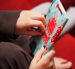 Image showing Opening the Cristmas Presents