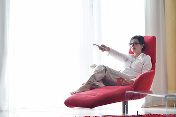 Image showing happy young woman relax at home on sofa