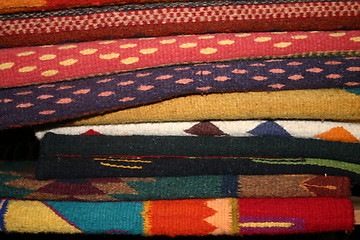 Image showing Pile of colorful Mexican rugs