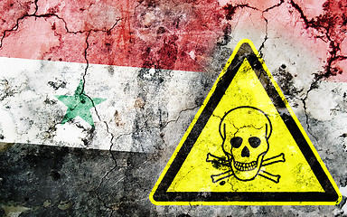 Image showing Old cracked wall with poison warning sign and painted flag