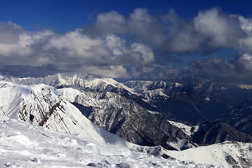 Image showing Winter sunlit mountains in clouds