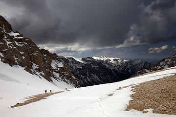 Image showing Group of hikers in snowy mountains before storm