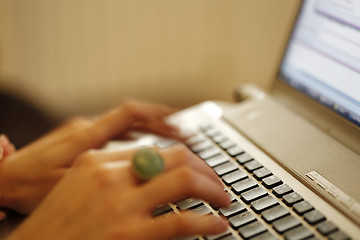 Image showing Young woman working on laptop