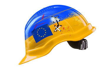 Image showing Blue and yellow hard hat with cracks, scratches and EU flag. KIE