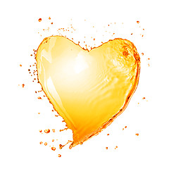 Image showing Heart from yellow water splash with bubbles isolated on white