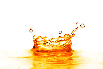 Image showing orange water splash isolated on white