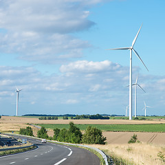 Image showing Wind generator turbine on summer landscape