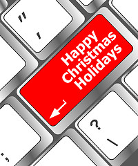 Image showing happy christmas holidays button on computer keyboard key