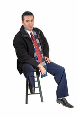 Image showing Man sitting in coat.