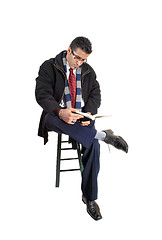 Image showing Man reading in book.