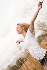 Image showing young happy attractive woman arms wide open 