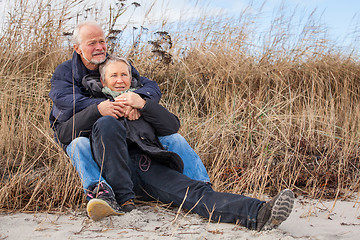 Image showing happy mature couple relaxing baltic sea dunes 